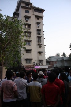 With no apparent organization, the crowds gather outside Khan's Mumbai apartment.